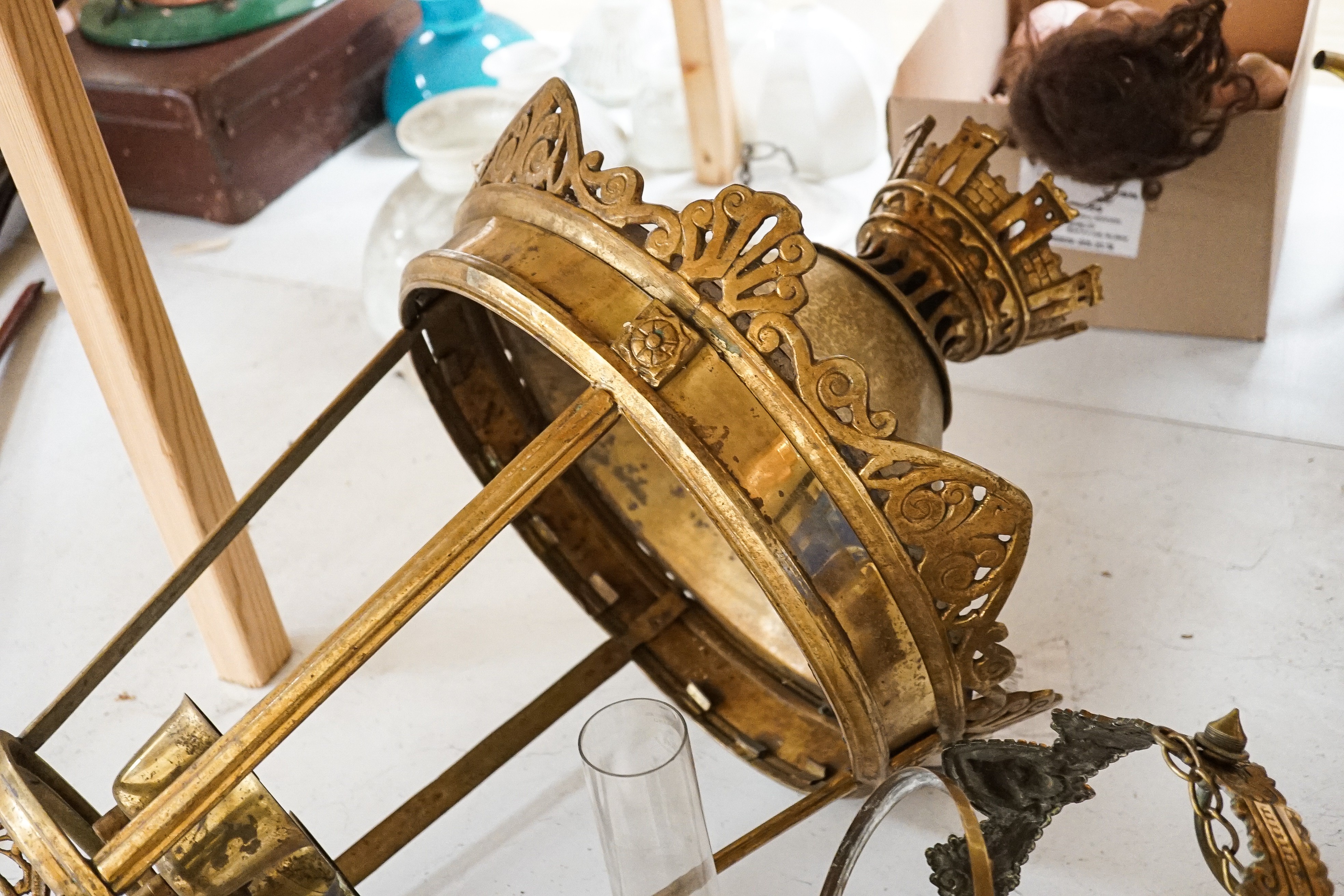 An Edwardian brass hanging oil lamp with opaque shade, overall drop 80cm Together with a large brass hall lantern